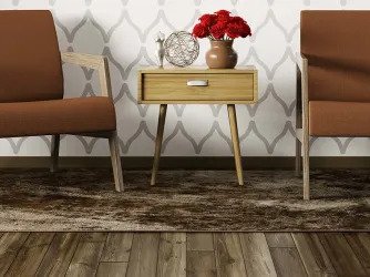 two brown chairs and side table on area rug